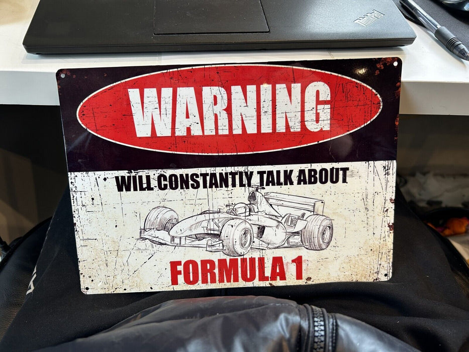 "warning will constantly talk about formula 1" sign